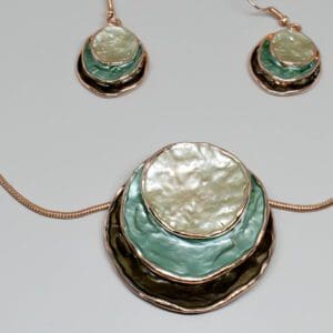 A necklace and earrings set with mother of pearl.