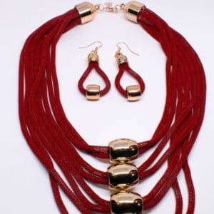 A necklace and earrings set with red cords.