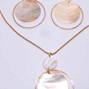 A necklace and earrings set with mother of pearl.