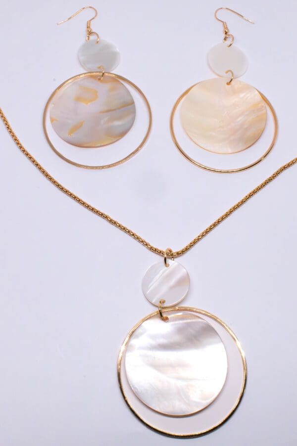 A necklace and earrings set with mother of pearl.