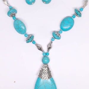 A turquoise necklace and earring set with silver accents.