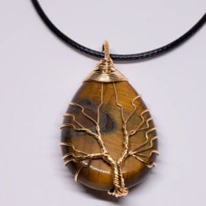 A necklace with a tree of life on it.