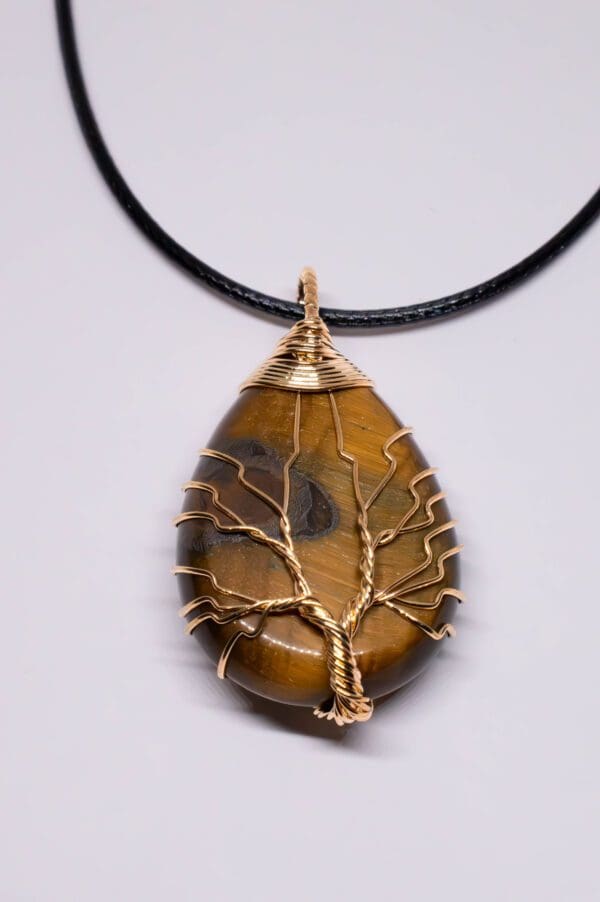 A necklace with a tree of life on it.