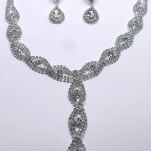 A necklace and earrings set with rhinestones.