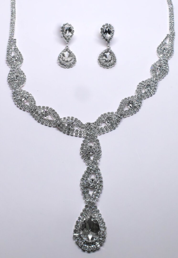 A necklace and earrings set with rhinestones.