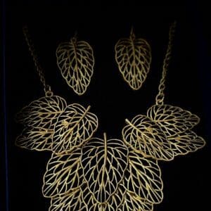 A necklace and earrings set with gold leaves.