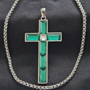 A cross is shown on a chain.