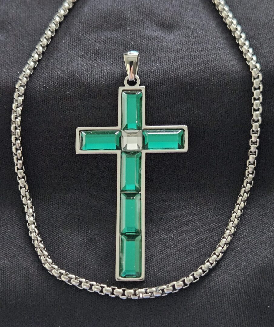 A cross is shown on a chain.