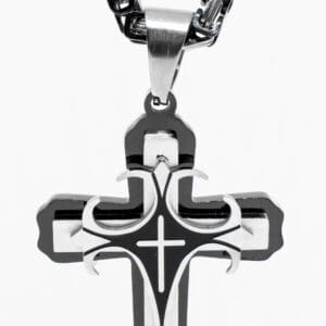 A cross with a chain hanging from it.