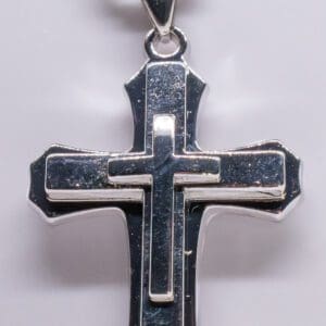 A cross is shown with two sides of it.