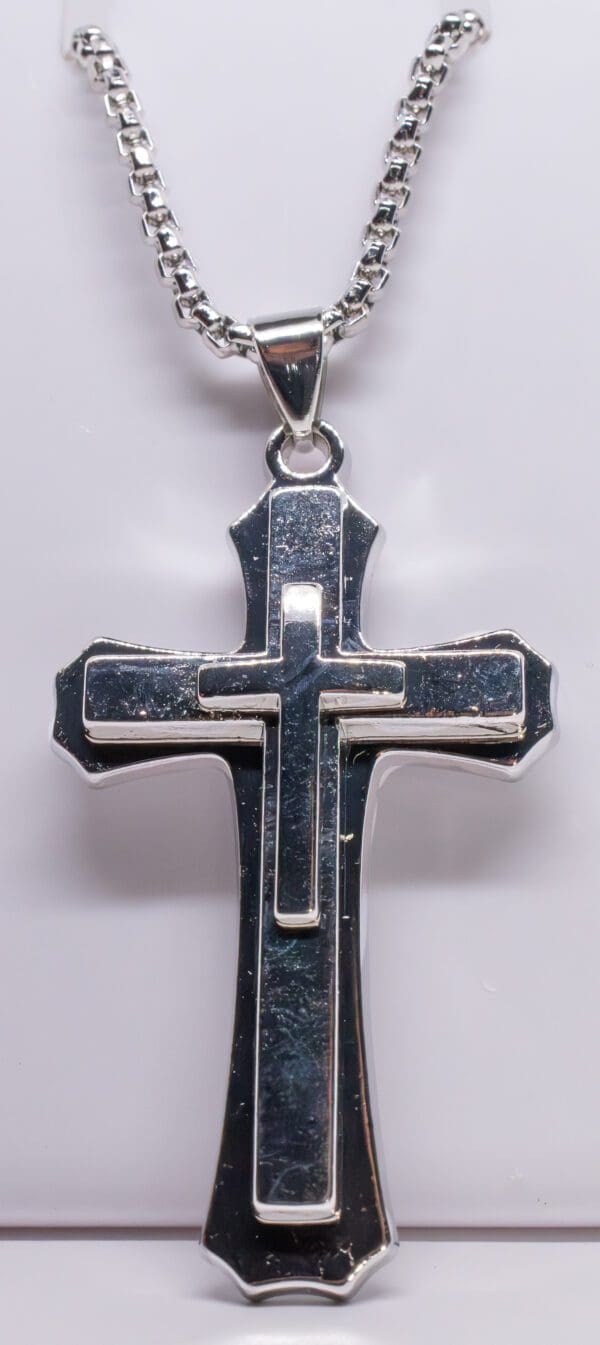 A cross is shown with two sides of it.