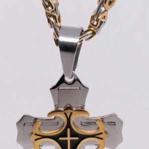 A cross with gold and black accents on a chain.